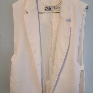 White sleeveless blazer from Zara.